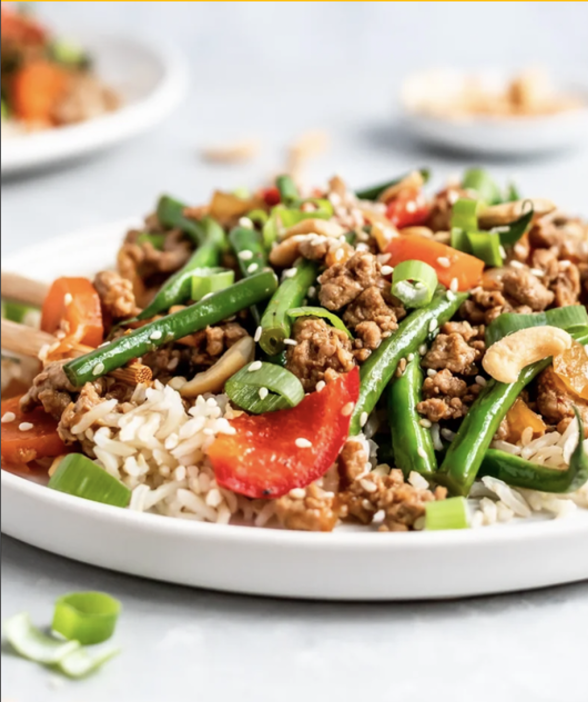 Teriyaki sauce on beef, green beans, and rice