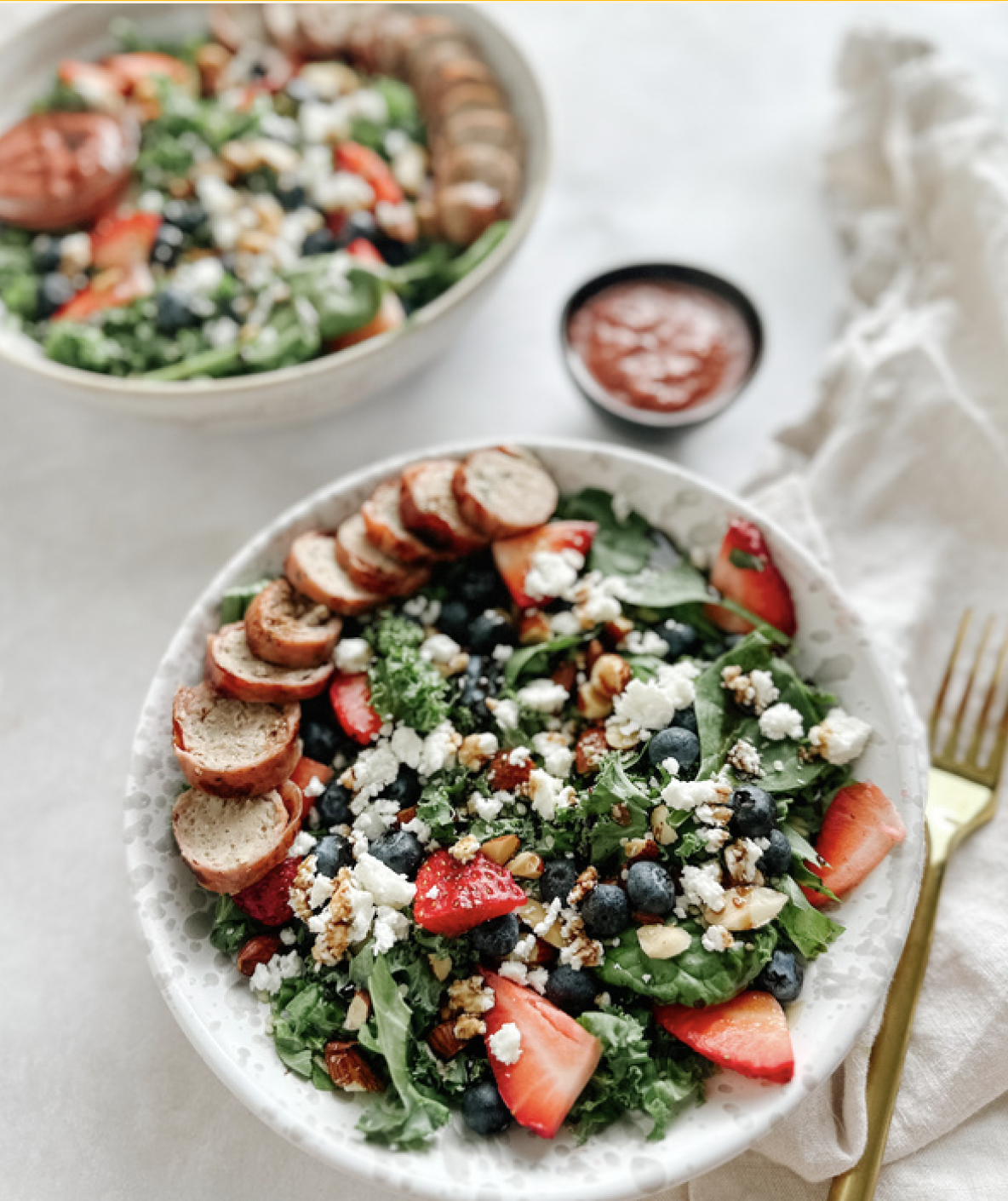 Strawberry Vinaigrette on a feta spinach salad with sausage