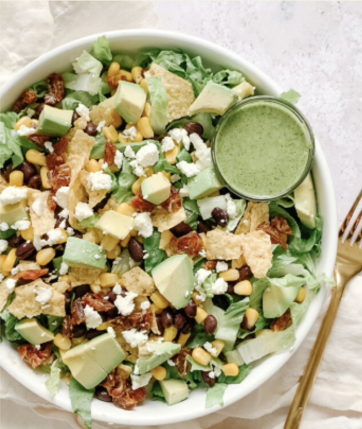 Creamy Cilantro Lime Sauce on a santa fe salad